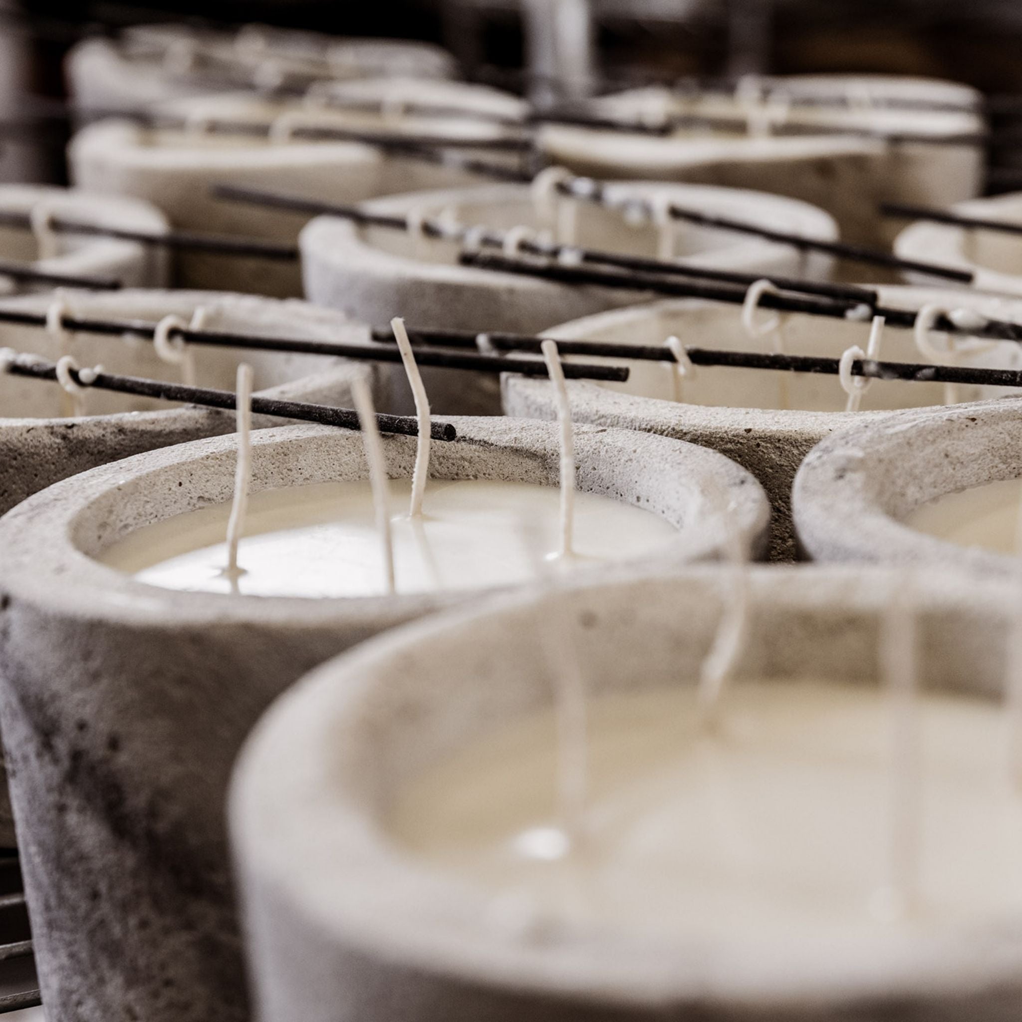 Freshly poured candles that are drying.