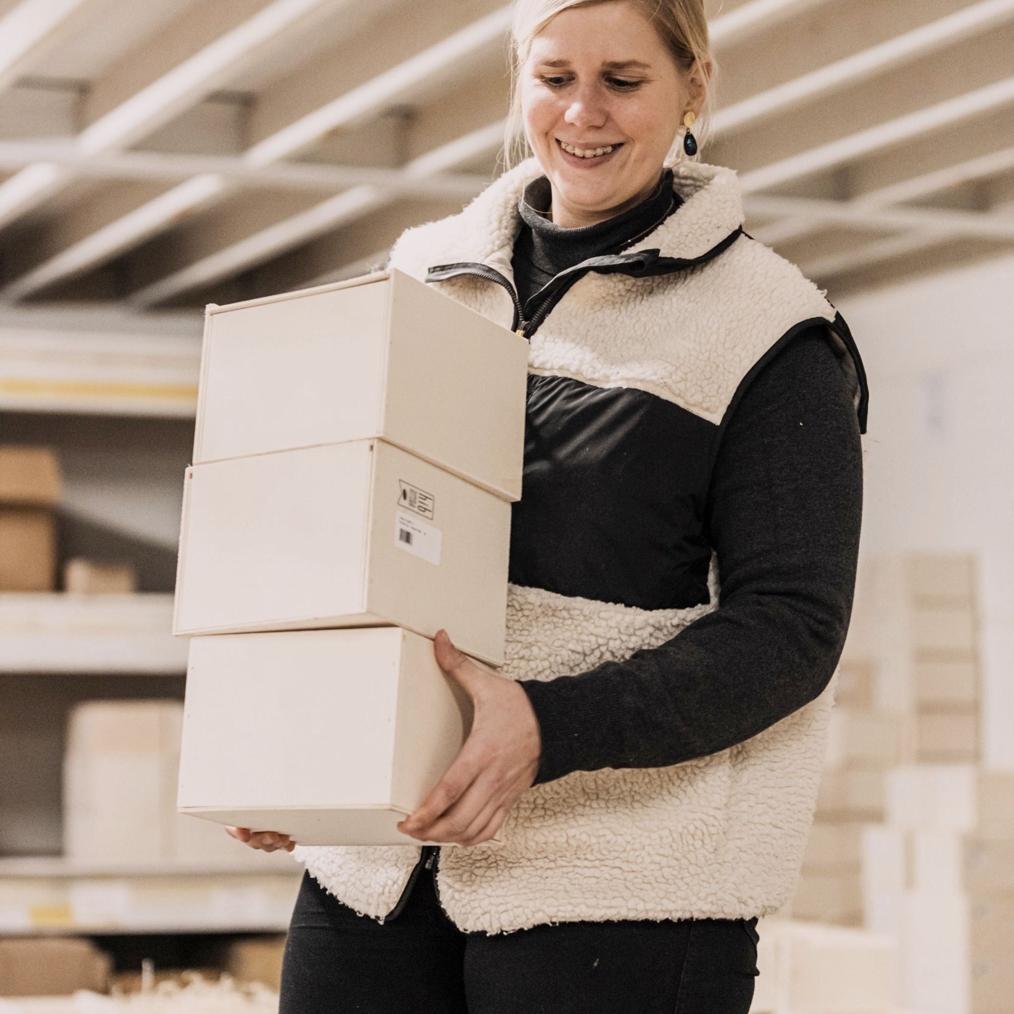 Export, hr & logistic boss carrying wooden boxes with candles.