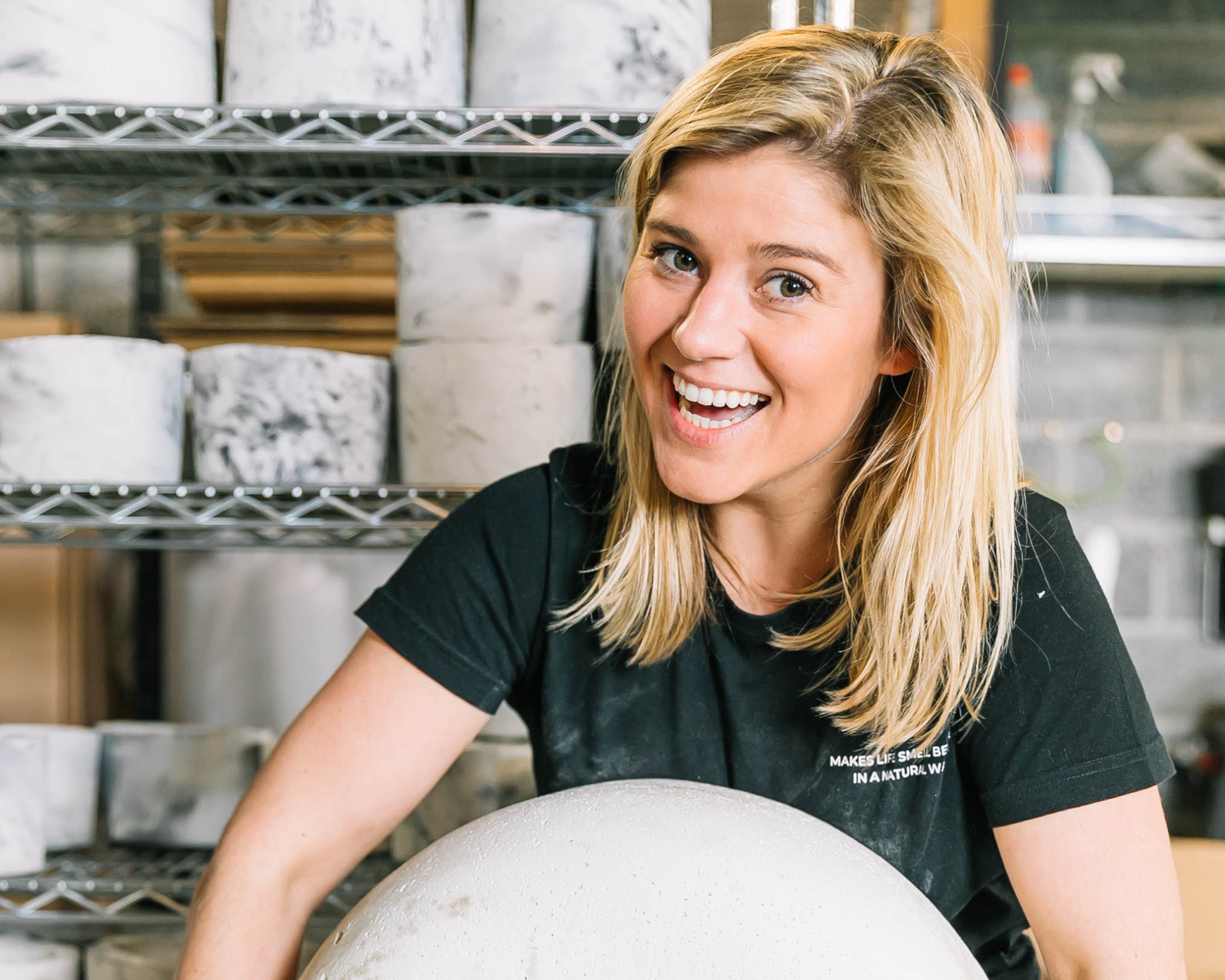 female entrepreneur and her concrete candles