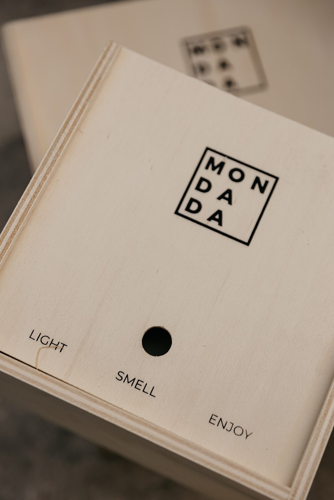 Mon Dada gift boxes, in which candles are packed. On the box is written "Mon Dada", and "light, smell, enjoy".